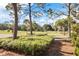 Lush green space with mature trees and landscaping, near golf course at 3617 Cherry Hill Dr, Orlando, FL 32822