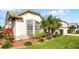 Close up of landscaped yard with verdant shrubs and mulch surrounding the home's foundation at 3617 Cherry Hill Dr, Orlando, FL 32822