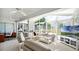 Bright, sunlit living room with plush seating, scenic views, and a ceiling fan for year-round comfort at 3617 Cherry Hill Dr, Orlando, FL 32822