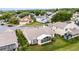Aerial view of a home with a sunroom and well-maintained landscaping in a suburban neighborhood at 3617 Cherry Hill Dr, Orlando, FL 32822