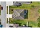 Overhead view showcases the home's roof, landscaping, driveway, and surrounding neighborhood at 3808 Enchantment Ln, St Cloud, FL 34772