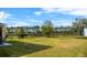 Spacious backyard features a large, level lawn and a secure black metal fence at 3808 Enchantment Ln, St Cloud, FL 34772