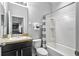 Bathroom with a shower-tub combination, single sink vanity and neutral color palette at 3808 Enchantment Ln, St Cloud, FL 34772