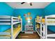 Colorful bedroom featuring bunk beds and decorative shelving at 3808 Enchantment Ln, St Cloud, FL 34772