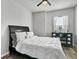 A bright bedroom featuring a ceiling fan, and wood floors at 3808 Enchantment Ln, St Cloud, FL 34772