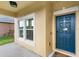 Charming home entrance with manicured bushes, mulch, and a welcoming front porch area at 3808 Enchantment Ln, St Cloud, FL 34772