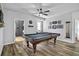 A game room with a pool table, ceiling fan, and wood floors at 3808 Enchantment Ln, St Cloud, FL 34772