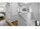 Hallway with wood-look flooring, natural light and access to other rooms at 3808 Enchantment Ln, St Cloud, FL 34772