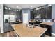 Well-equipped kitchen featuring stainless appliances, granite countertops, and dark-stained cabinets at 3808 Enchantment Ln, St Cloud, FL 34772