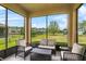 Screened lanai with comfortable seating overlooking the spacious backyard at 3808 Enchantment Ln, St Cloud, FL 34772