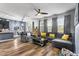 Inviting living room with natural light, a large sofa, wood-look floors and backyard views at 3808 Enchantment Ln, St Cloud, FL 34772