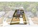 An aerial view of the property featuring a driveway and lush landscaping at 428 Winding Oak Ln, Longwood, FL 32750