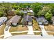 Neighborhood aerial view of home with a manicured lawn, long driveway, and mature trees at 428 Winding Oak Ln, Longwood, FL 32750