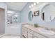 Bright bathroom featuring double sinks, mirrors, and walk-in tub at 428 Winding Oak Ln, Longwood, FL 32750
