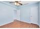 Bedroom featuring neutral paint, wood-look floors, walk-in closet, and ceiling fan at 428 Winding Oak Ln, Longwood, FL 32750