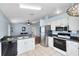 Well-equipped kitchen with stainless steel appliances, ample counter space, and open layout at 428 Winding Oak Ln, Longwood, FL 32750