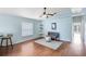 Comfortable living room featuring wood floors, modern decor, a ceiling fan and lots of natural light at 428 Winding Oak Ln, Longwood, FL 32750