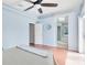 Bedroom featuring hardwood floors, ceiling fan, en suite bathroom, and lots of natural light at 428 Winding Oak Ln, Longwood, FL 32750
