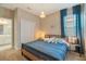 Bedroom boasts warm textures, closet and ensuite bathroom at 4418 Shiva Loop, Kissimmee, FL 34746