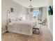 Bright bedroom with plush carpet, pendant lighting, king size bed, neutral paint, and stylish modern furnishings at 4418 Shiva Loop, Kissimmee, FL 34746