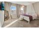 Airy main bedroom with a canopy bed, a mirror and lots of natural light at 4418 Shiva Loop, Kissimmee, FL 34746