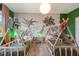 Sweet bedroom boasting whimsical safari wallpaper, twin teepee beds and custom decor at 4418 Shiva Loop, Kissimmee, FL 34746
