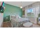 Bright bedroom featuring natural light, calm colors and decor at 4418 Shiva Loop, Kissimmee, FL 34746