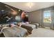Shared bedroom with three beds and vibrant space-themed mural at 4418 Shiva Loop, Kissimmee, FL 34746