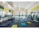 Community gym with treadmills, free weights, cable machines, and plenty of natural light at 4418 Shiva Loop, Kissimmee, FL 34746
