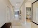Hallway view with neutral colors, modern decor, and access to other rooms at 4418 Shiva Loop, Kissimmee, FL 34746