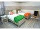 Cozy bedroom featuring two twin beds with colorful accents and playful decor at 4420 Shiva Loop, Kissimmee, FL 34746