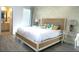 Elegant bedroom featuring a king-sized bed and an ensuite bathroom for added privacy at 4420 Shiva Loop, Kissimmee, FL 34746