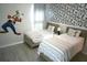 Whimsical bedroom featuring two twin beds with colorful accents and playful Goofy decor at 4420 Shiva Loop, Kissimmee, FL 34746
