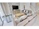 Comfortable living room with stylish decor, large TV, a ceiling fan and staircase to the second floor at 4420 Shiva Loop, Kissimmee, FL 34746