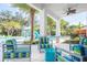 Resort style pool with splash pad, outdoor seating, and beautiful landscaping at 4420 Shiva Loop, Kissimmee, FL 34746