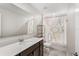 Bright bathroom with a modern vanity, stylish shower curtain, and tiled floor at 4423 Blackbird St, Kissimmee, FL 34746