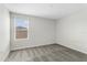 Bright bedroom featuring neutral paint, plush carpeting, and a window offering plenty of natural light at 4423 Blackbird St, Kissimmee, FL 34746