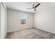 Cozy bedroom featuring a contemporary ceiling fan, neutral walls, and soft carpeting at 4423 Blackbird St, Kissimmee, FL 34746