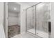 This bright bathroom features a spacious glass-enclosed shower and easy access to the walk-in closet at 4423 Blackbird St, Kissimmee, FL 34746