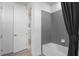 Clean bathroom with gray tile, tub, and modern fixtures at 4619 Flagstaff Ct, Orlando, FL 32820