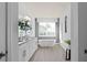 Bright, modern bathroom featuring double vanity, soaking tub, and large window at 4619 Flagstaff Ct, Orlando, FL 32820