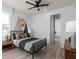 Cozy bedroom with a metal bed frame and geometric accent wall at 4619 Flagstaff Ct, Orlando, FL 32820