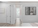Light and bright bedroom with art and decorative accents, leading to bathroom at 4619 Flagstaff Ct, Orlando, FL 32820