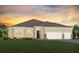 Beautiful one-story home with a three-car garage and manicured lawn at 4619 Flagstaff Ct, Orlando, FL 32820