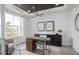 Modern office with stylish light fixture, desk, and storage at 4619 Flagstaff Ct, Orlando, FL 32820