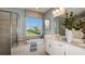 The bathroom features a large garden tub, big window, double vanity, and a framed glass shower at 5235 Bowspirit Way, St Cloud, FL 34771