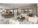 Open-concept living room and kitchen with a dining table, plush sofa, and stylish decor at 5235 Bowspirit Way, St Cloud, FL 34771