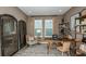 An office features a large desk, chair, shelving, rug and window at 5235 Bowspirit Way, St Cloud, FL 34771
