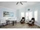 Home office with coastal decor, wood floors, and two desk setups at 5896 Barclay Ct, The Villages, FL 32163