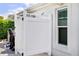 Outdoor shower featuring white privacy screen and a convenient location near the house at 5896 Barclay Ct, The Villages, FL 32163
